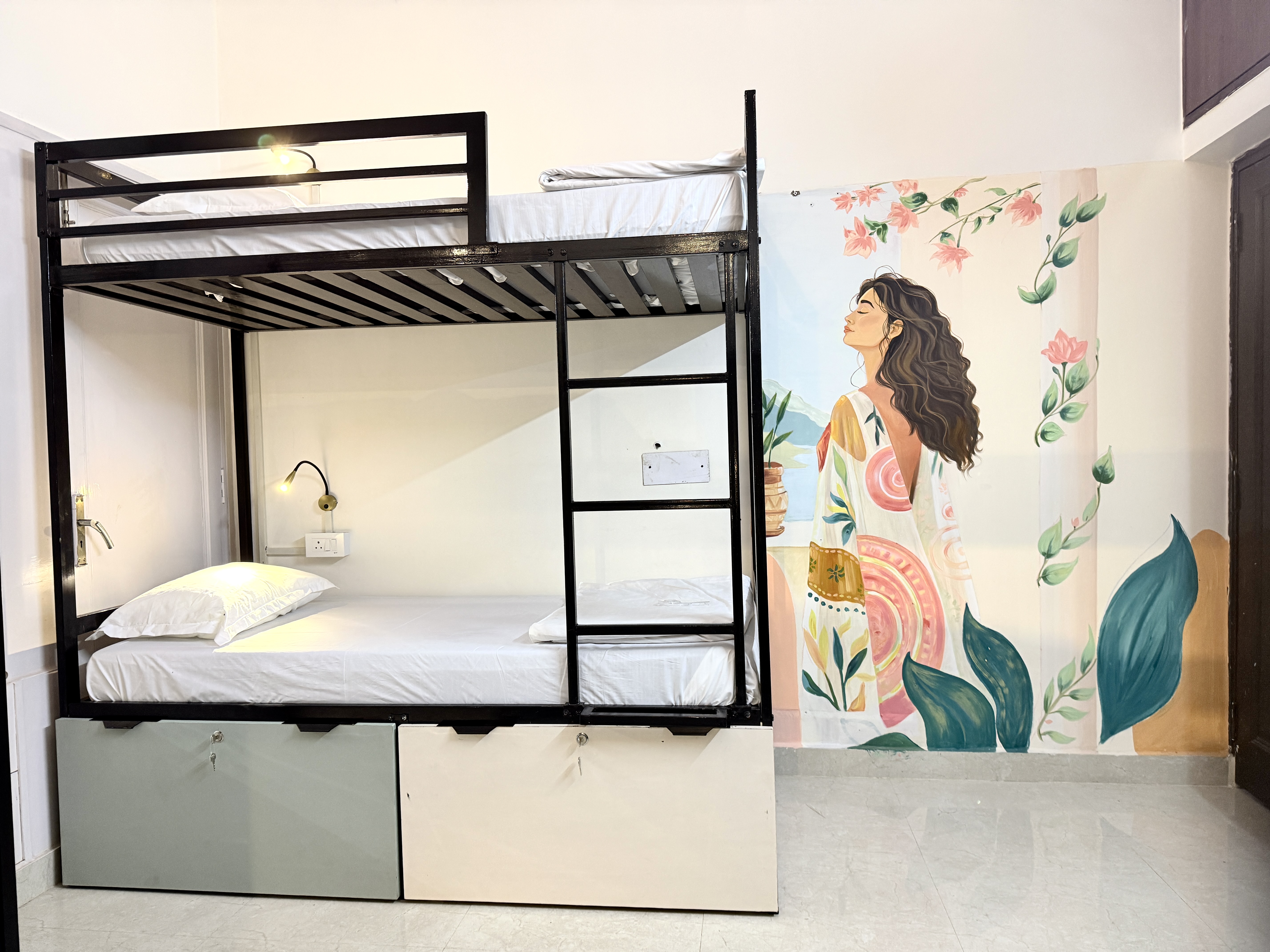 HOSHTEL99 Delhi dorm with pendant lights and botanical wall art