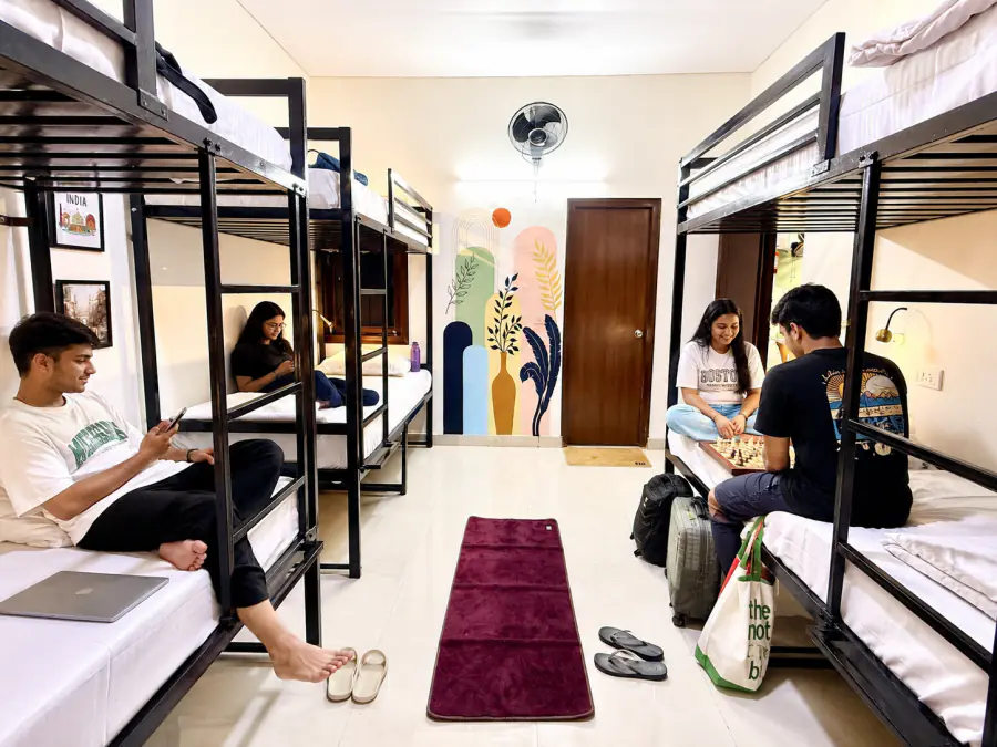 Guests spending time together in a HOSHTEL99 Delhi mixed dorm