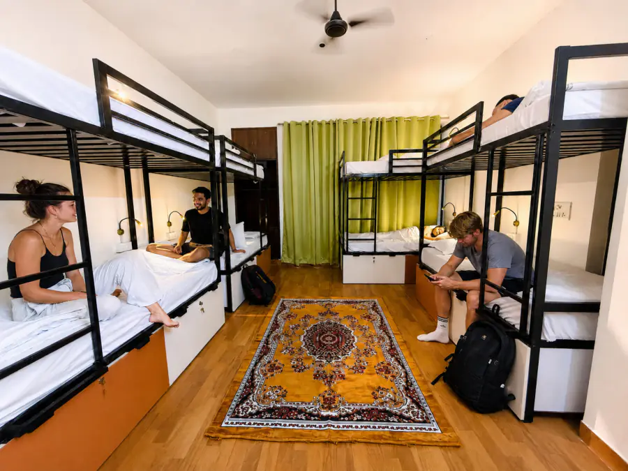 Travellers relaxing together in a HOSHTEL99 Delhi mixed dorm