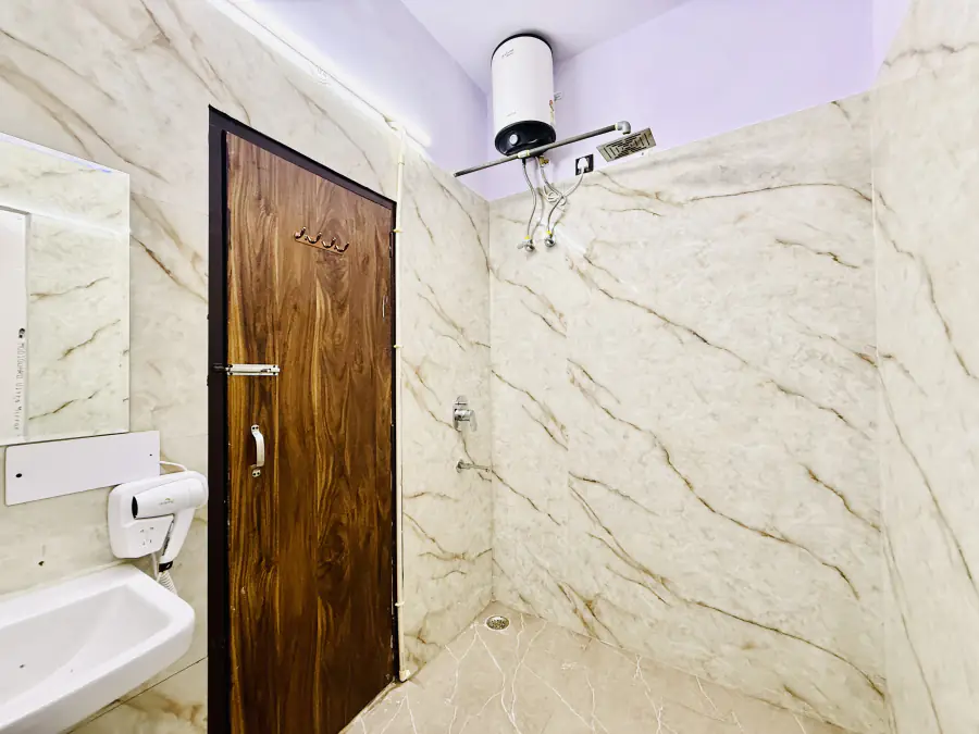 HOSHTEL99 Delhi washroom with a shower and vanity basin